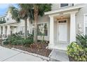 Inviting front entrance with well-maintained landscaping and a covered porch at 12285 Country White Cir, Tampa, FL 33635