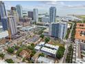 Panoramic aerial view of a coastal city featuring modern high-rise buildings, waterfront views, and vibrant green spaces at 337 4Th S Ave, St Petersburg, FL 33701