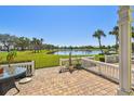 Spacious outdoor patio featuring a beautiful lake view at 4744 Snook Se Dr, St Petersburg, FL 33705