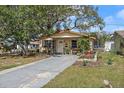 Inviting single-Gathering home with beautiful landscaping and a cozy front porch at 5559 17Th N Ave, St Petersburg, FL 33710