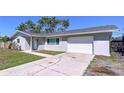 Street view of single story home with grey paint, white trim, and attached one car garage at 620 43Rd Street W Blvd, Palmetto, FL 34221