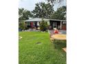 Expansive lawn and patio area, ideal for outdoor entertaining or relaxed living at 2102 W Ivy St, Tampa, FL 33607