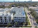 This is an aerial view of the townhome showcasing its prime location near downtown with beautiful skyline views at 2510 W Cleveland St # 3, Tampa, FL 33609