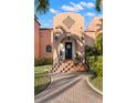 Charming front entrance with terracotta tile walkway, steps with decorative tile risers, and arched door at 6935 Date Palm S Ave, St Petersburg, FL 33707