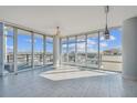 Bright, open living space with floor-to-ceiling windows showcasing city views and modern tile flooring at 1208 E Kennedy Blvd # 1115, Tampa, FL 33602
