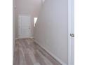 Bright foyer with sleek, modern flooring, white walls, and high ceilings creates a grand entry at 13106 Zolo Springs Cir, Riverview, FL 33579