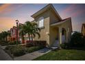 Beautiful exterior elevation showcasing a two-story home with well-maintained landscaping and a charming entrance at 18 Franklin S Ct # D, St Petersburg, FL 33711