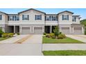 Inviting townhome with a well-kept lawn, two-car garage, and convenient driveway at 9716 Mulberry Marsh Ln, Sun City Center, FL 33573
