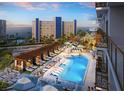 A vibrant pool area with lounge chairs, cabanas, and ocean views offers guests a relaxing getaway at 15000 Madeira Way # 611, Madeira Beach, FL 33708