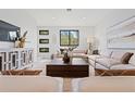 Bright living room features neutral tones, large windows, and an elegant console table at 532 W Plaza Pl # 2, Tampa, FL 33602