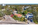 Charming home with a white picket fence surrounded by mature landscaping and mature trees at 1011 W Columbus Dr, Tampa, FL 33602