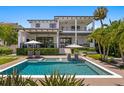 Luxurious pool and spa area, surrounded by lush landscaping, perfect for relaxation and entertainment at 5004 S The Riviera, Tampa, FL 33609