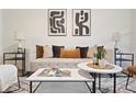 Stylish living room featuring neutral tones, modern art, and ample natural light at 1910 E Palm Ave # 10301, Tampa, FL 33605