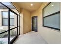 Covered front porch area with a screened entryway, providing a welcoming outdoor space at 438 Seneca Falls Dr, Apollo Beach, FL 33572