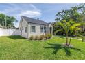 Well-kept single-story home with lush landscaping and mature palm trees at 4541 2Nd N Ave, St Petersburg, FL 33713