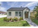 Charming home with a lush green lawn, inviting walkway, and freshly painted facade at 4541 2Nd N Ave, St Petersburg, FL 33713