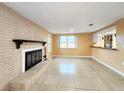 Spacious living room featuring a fireplace and tile floors at 6718 Ranchwood Loop, New Port Richey, FL 34653
