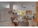 Bright living room and kitchen combo boasts an open floor plan and light tile flooring, creating an inviting space at 1875 Oak Branch Dr, Sarasota, FL 34232