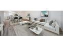 A sun filled staged living room provides open concept and comfy elegance at 256 Cypress Ln # 120, Oldsmar, FL 34677