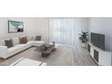 Bright living room features a neutral color palette and large windows for ample natural light at 256 Cypress Ln # 120, Oldsmar, FL 34677