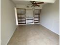 Dining room with tiled floor and built in shelves at 3223 Coats Rd, Zephyrhills, FL 33541