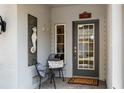 Inviting front porch featuring seating and nautical décor, providing a welcoming entrance to the home at 3226 Nautical S Pl, St Petersburg, FL 33712