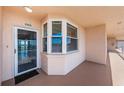 Condo exterior featuring unit number, door to the residence, and a small outdoor area at 6315 Shoreline Dr # 3305, Madeira Beach, FL 33708