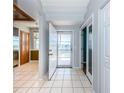 Bright foyer with tile flooring, leading to a view of the balcony and various rooms at 6315 Shoreline Dr # 3305, Madeira Beach, FL 33708