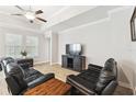 Comfortable living room featuring modern furniture, wood-look flooring, and ample natural light at 9645 Little Bluestem Dr, Land O Lakes, FL 34637