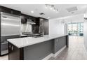 A modern kitchen with a large island, stainless steel appliances, and an open layout at 1120 E Kennedy Blvd # 1126, Tampa, FL 33602