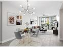 A stylish living and dining space features contemporary decor and a beautiful view at 1120 E Kennedy Blvd # 1126, Tampa, FL 33602