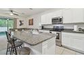 Modern kitchen with granite countertops and stainless steel appliances offering style and functionality at 3313 Pleasant Willow Ct, Brandon, FL 33511