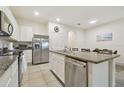 Bright kitchen with granite countertops and stainless steel appliances and adjacent dining area at 3313 Pleasant Willow Ct, Brandon, FL 33511