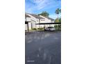 Exterior view of covered parking and condo property on a sunny day at 5162 Puritan Cir # 5162, Tampa, FL 33617