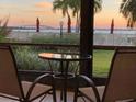 Covered patio with comfortable seating and beautiful bay views at 6365 Bahia Del Mar Blvd # 112, St Petersburg, FL 33715