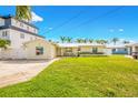 Charming single-story home with a well-manicured lawn and a convenient two-car driveway at 7984 1St S Ave, St Petersburg, FL 33707