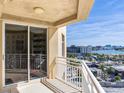 Condo balcony featuring stunning city and water views and a white railing at 11 San Marco St # 807, Clearwater Beach, FL 33767