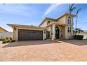 Two-story home showcasing a brick driveway and two-car garage at 1336 51St Ne Ave, St Petersburg, FL 33703