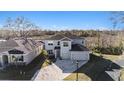 Beautiful two-story home with a paved driveway and a well-manicured lawn at 22990 Scaglione Dr, Lutz, FL 33549