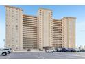 Expansive condo complex with multiple units and balconies, convenient parking, and a well-maintained exterior at 5200 Brittany S Dr # 902, St Petersburg, FL 33715