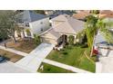 An aerial view of a single-Gathering home in a suburban neighborhood at 11444 Village Brook Dr, Riverview, FL 33579