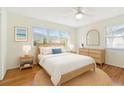 Inviting bedroom with a comfortable bed, natural light, and stylish furnishings at 349 Shirley Ave, Belleair, FL 33756