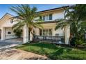 Charming two-story home featuring a well-manicured lawn and attractive curb appeal at 4937 Dover Ne St, St Petersburg, FL 33703