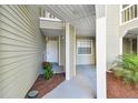 Charming condo entrance with a well-maintained courtyard and inviting walkway at 6916 Stonesthrow N Cir # 9103, St Petersburg, FL 33710