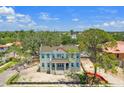 Aerial view of two-story home with mature trees and lush landscaping in a desirable neighborhood at 805 17Th Ne Ave, St Petersburg, FL 33704