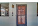 Condo entrance with decorative door, adjacent window, textured walls, and exterior light at 2612 Pearce Dr # 310, Clearwater, FL 33764