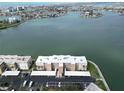 Beautiful aerial view of waterfront condos with covered parking and lovely landscaping at 7910 Sun Island S Dr # 305, South Pasadena, FL 33707