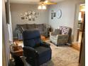 Inviting living room with hardwood floors, neutral paint, and comfortable seating arrangement, perfect for relaxation at 1811 Ridge S Rd, Largo, FL 33778