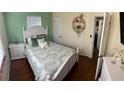Cozy bedroom featuring a queen bed, hardwood floors, and lots of natural light at 4710 22Nd N Ave, St Petersburg, FL 33713