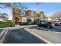 Exterior of condo featuring well-maintained landscaping and convenient parking at 2044 Greenwood Valley Dr, Plant City, FL 33563